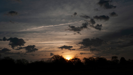 Fototapeta na wymiar Sunrise with moody clouds
