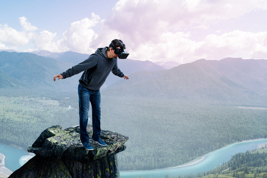 Virtual reality experience, young man in VR glasses