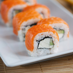 Sushi roll with salmon, avocado and cheese. Sushi menu. Japanese food.
