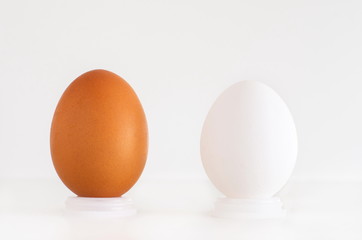 Brown and white eggs next to eachother