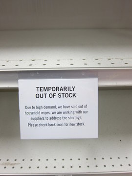 A Note On An Empty Store Shelf Says Household Disinfectant Wipes Are Temporarily Out Of Stock During The Coronavirus Pandemic