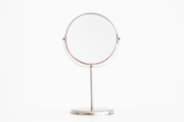 Fototapeta premium Magnifying mirror on stand isolated