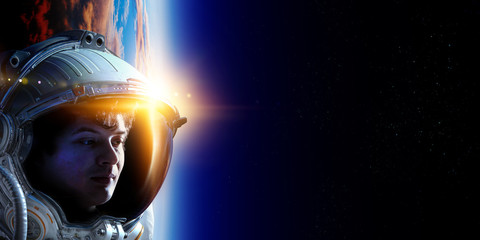 Astronaut in space on planet orbit.