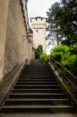 Fototapeta na wymiar Long stone stairway to a stonewall tower in Lucerne Swtizerland