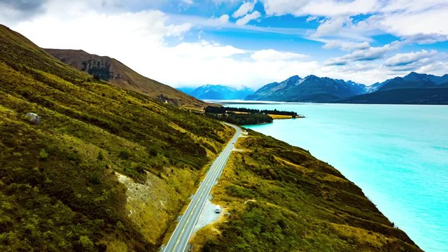 Time lapse of Scenic winding road along Lake Pukaki to Mount Cook National Park, South Island, New Zealand during summer. One of the most beautiful viewing point of Aoraki Mount Cook.