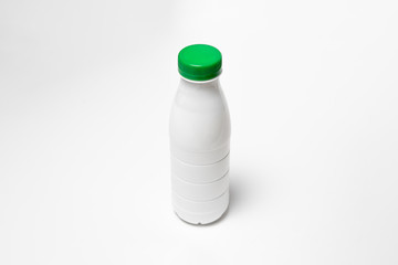 White glossy Plastic Bottle with screw cap for dairy products milk, drink yogurt, cream, dessert.Packaging Mockup template. High resolution photo.