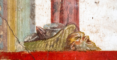 Winged cupids fight, little gods of ancient Rome in Pompeii. Pompeii was destroyed by the volcanic eruption of Vesuvius in 79 BC