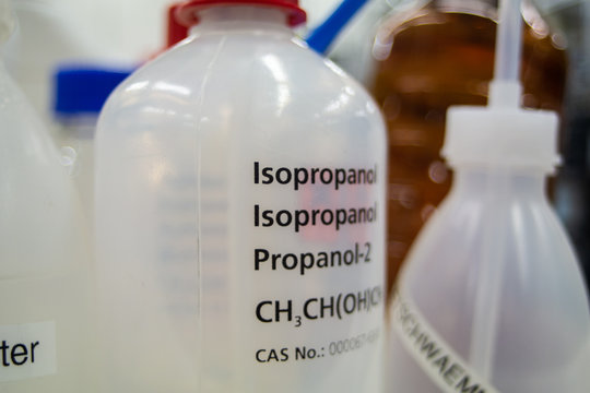 Set of empty plastic chemical bottles with straws in a lab environment Isopropyl isopropanol water other liquids
