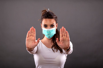 Woman with mask on her face to prevent pandemia