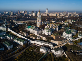 Aerial view Kyiv Pechersk Lavra churches on hills from above with morning fog, Ukraine