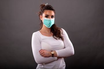 Woman with mask on her face to prevent pandemia