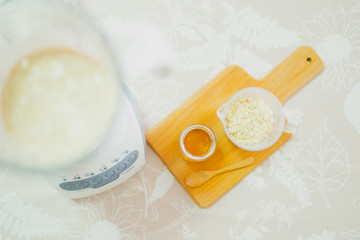 healthy lifestyle and diet concept from flat lay view by mix and spin oatmeal honey and other ingredients in bowl for make diet breakfast with copy space and soft focus background