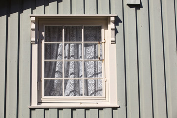 Lofoten Islands / Norway - August 28, 2017: House with traditional wood window, Lofoten Islands, Nordland, Norway, Scandinavia, Europe