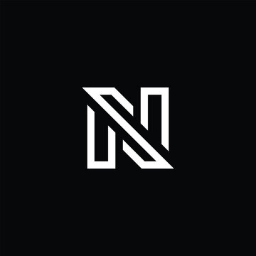  Minimal elegant monogram art logo. Outstanding professional trendy awesome artistic N NN NS SN initial based Alphabet icon logo. Premium Business logo White color on black background