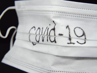 Corona virus Covid-19, Close-up of medical mask on a black background. Virus protection mask.