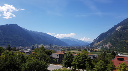 Fototapeta na wymiar View of the city of Chur, Switzerland, sitting between the mountains of the Alps