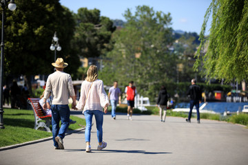 Lugano / Switzerland - June 01, 2019: Tourists walking near Lugano lake, Lugano, Switzerland, Europe