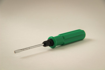 Green screwdriver on a white background