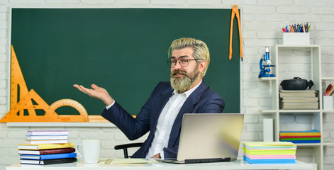 School teacher programming laptop. Learn programming language. Handsome man use modern technology. Digital technology. Programming web development. Apply online course. Selecting specific courses