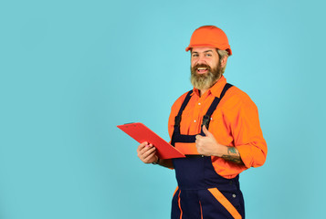 looking project folder. blueprint in folder. making notes in clipboard. portrait of engineering man. construction worker holding folder. Structural plan safety. work operation concept. copy space