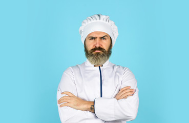 Cook chef in white uniform. Bearded man chef. Bearded man restaurant worker. Professional cook. Culinary concept. National cuisine. Restaurant menu. Lunch meal. Restaurant dish. Delicious dessert