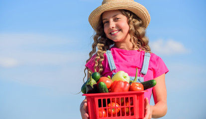 Vegetables market. Sunny day at farm. Selling homegrown food concept. Natural vitamin nutrition. Organic vegetables. Girl cute child farming. Gathering vegetables in basket. Village rustic style