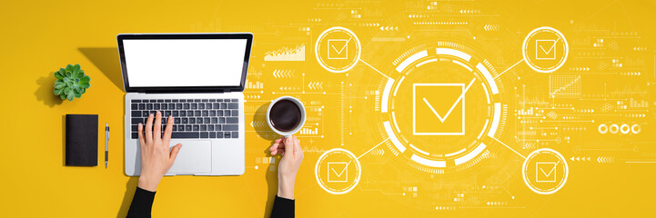 Checklist concept with person using a laptop computer