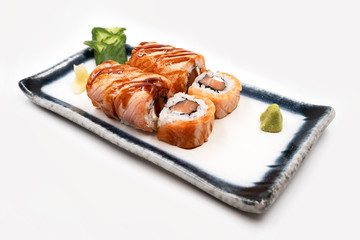 Salmon sushi set decorated with soy sauce