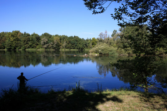 Castano Primo (MI), Italy - June 05, 2017: Fisherman near Ticino River, Castano Primo, Lombardy, Italy