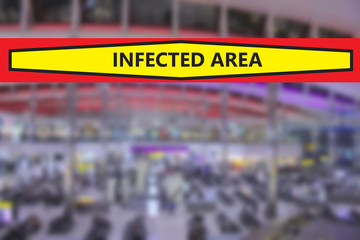 Blurred airport or station background with a banner warning that the area is infected