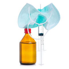 glass medicine bottle with syringe injection, medical mask on white background isolation