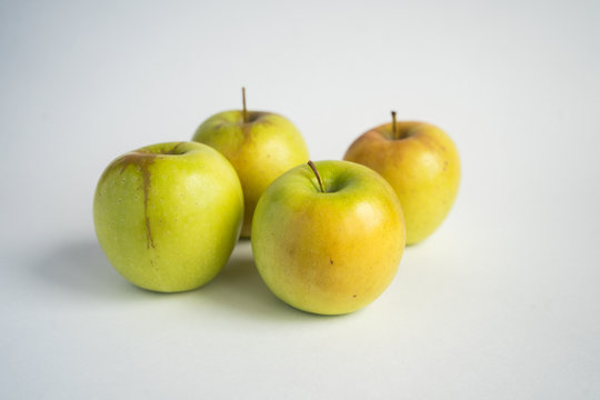 green-yellow apples on a white background. Fruit isolate