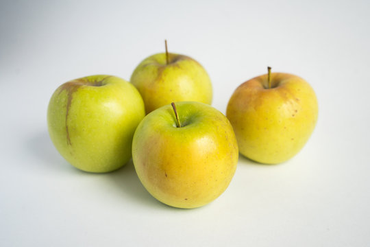 green-yellow apples on a white background. Fruit isolate