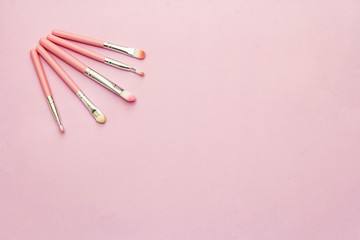 Makeup cosmetic set on pink background