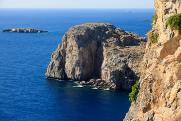Lindos, Rhodes / Greece - June 23, 2014: The cliffs view near Lindos, Rhodes, Dodecanese Islands,...