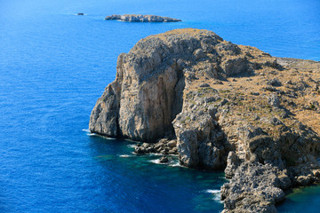 Fototapeta premium Lindos, Rhodes / Greece - June 23, 2014: The cliffs view near Lindos, Rhodes, Dodecanese Islands, Greece.