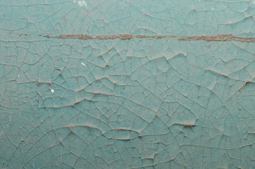 Old painted wall with cracked paint