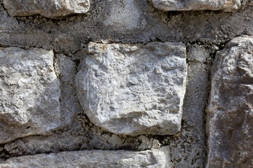 A close view of the old stone wall surface.
