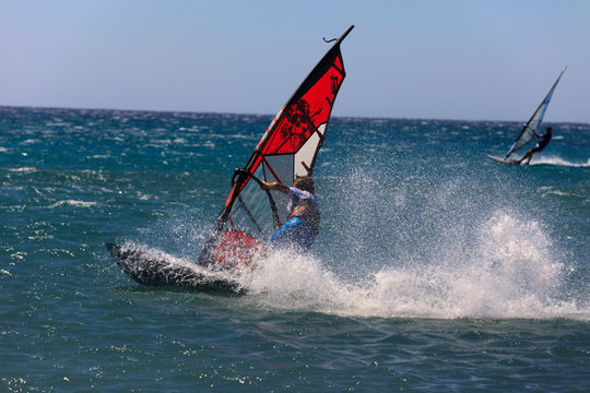 Prasonissi, Rhodes / Greece - June 23, 2014: Surfer at Cape of Akra Prasonisi, Rhodes, Dodecanese Islands, Greece.