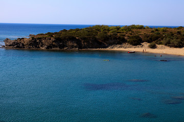 Fototapeta na wymiar Lindos, Rhodes / Greece - June 23, 2014: A beach near Lindos, Rhodes, Dodecanese Islands, Greece.