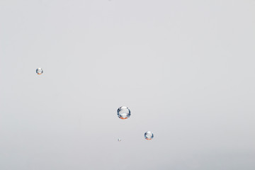CO2 bubbles in mineral water attached to glass