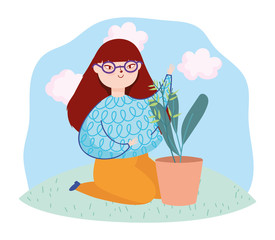 young woman on the knees with white potted plant