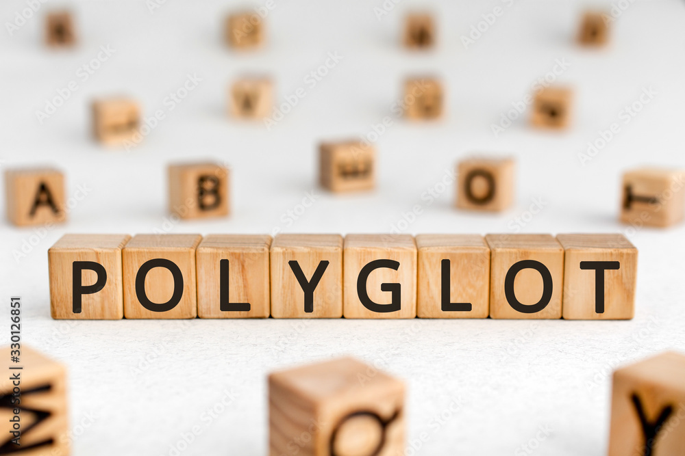 Aufkleber polyglot - word from wooden blocks with letters, knowing or using several languages polyglot concept
