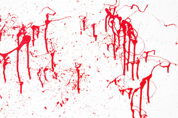 Bright red streaks of paint reminiscent of blood on a white surface. Abstract creative background.