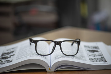 Take a break from reading and take off your glasses and place it on the book,select focus.