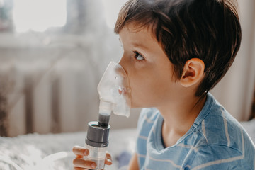 sick child breathes in a nebulizer
