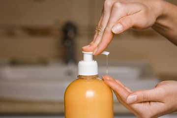 A Washing hands with soap under the faucet with water