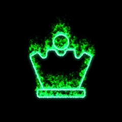The symbol chess queen burns in green fire