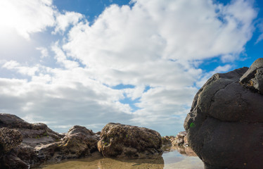 Big stone on a sandy beach near the sea