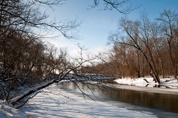 The Tippecanoe River flows quietly through the winter landscape in rural northern Indiana.